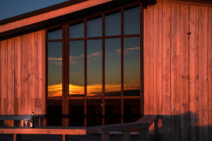 Sunset reflected in the window at the WTMC Mt Ruapehu Lodge