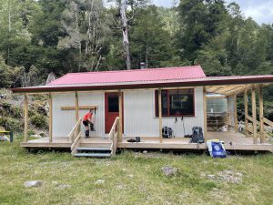 Jamie taking her gaiters off at Irongate Hut