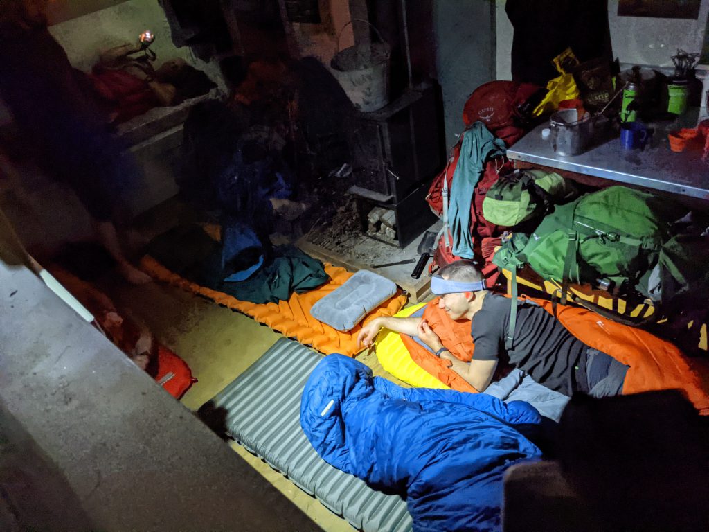Masses of tramping gear in a small hut