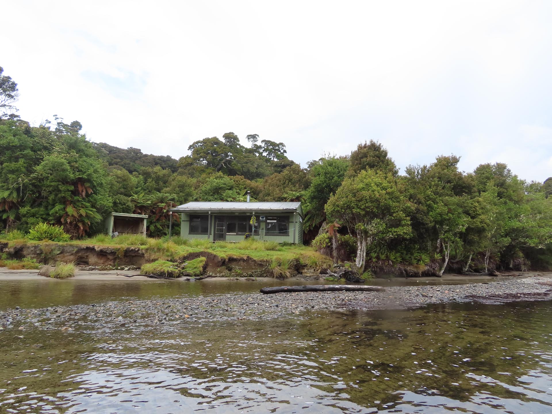 Yankee River Hut located on a grassy ledge right next to the beach