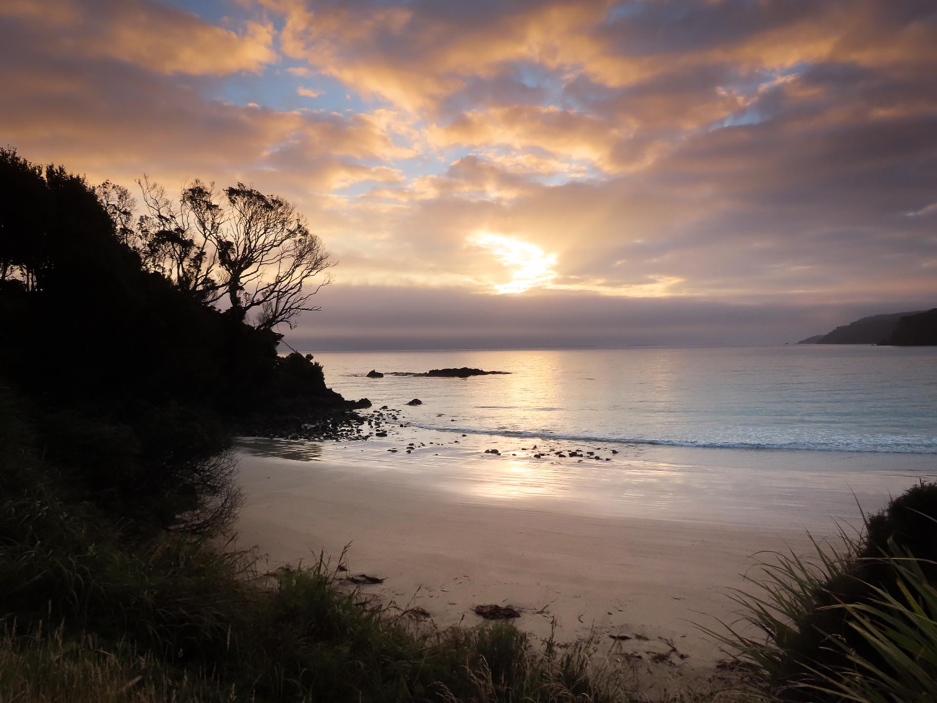 The sun rises over the beach at Bungaree Hut
