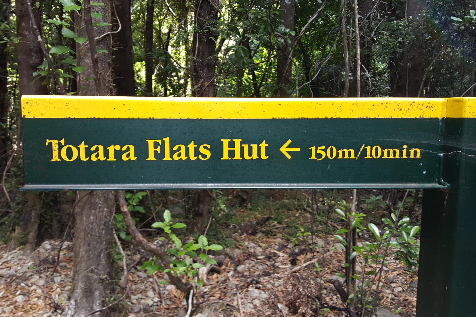Totara Flats Hut sign with incorrect time to hut?
