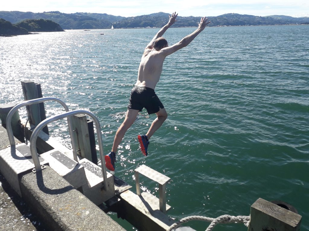 Tony S jumping off the wharf on Matiu/Somes Island