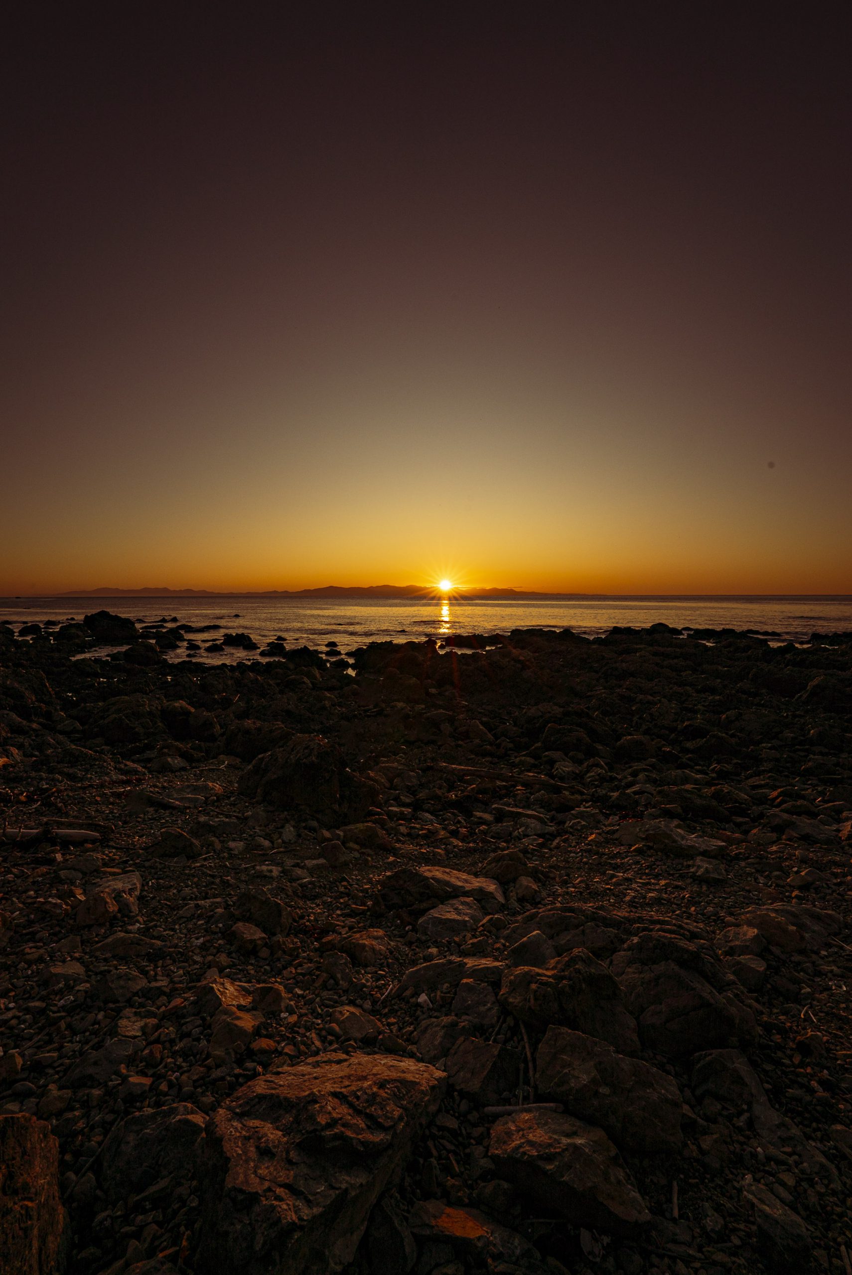 Makara Walkway - sun setting over South Island