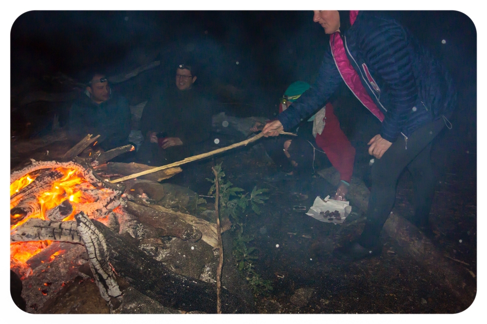 Toasting marshmallows with kransky over the campfire