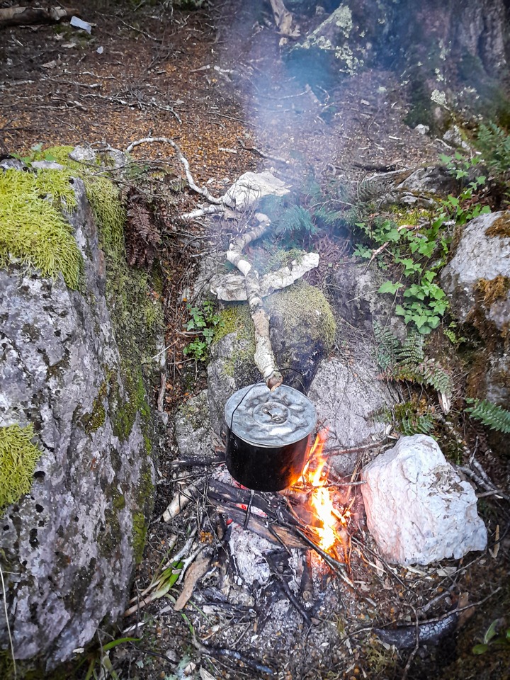Cooking tea in the billy over an open fire