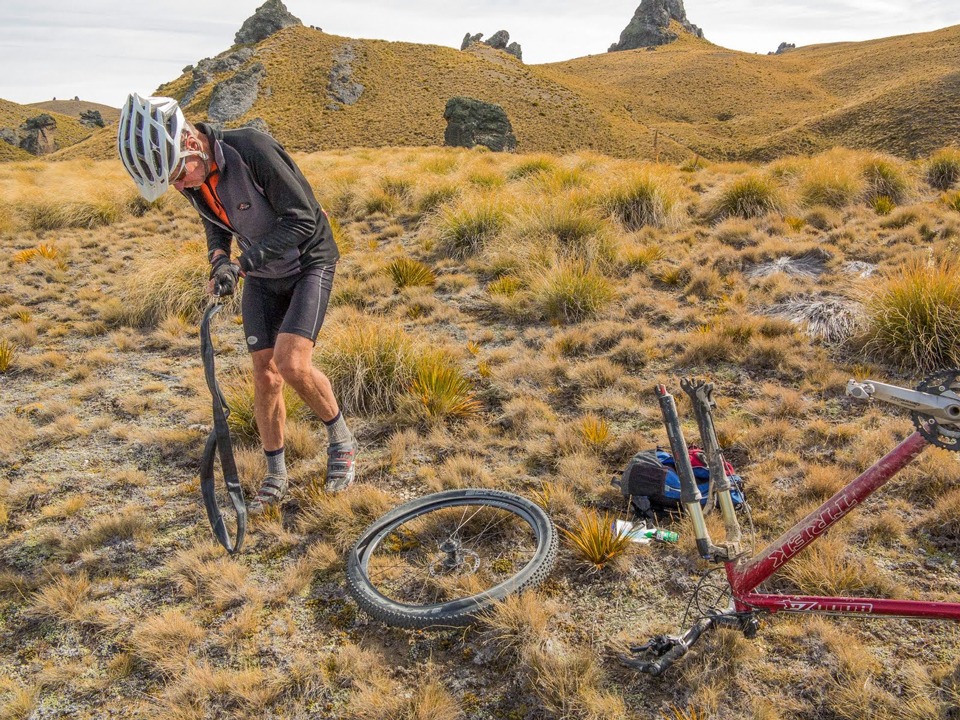 Fixing one of the 7 punctures from the baby Spaniard plants on the Pisa Range, Otago