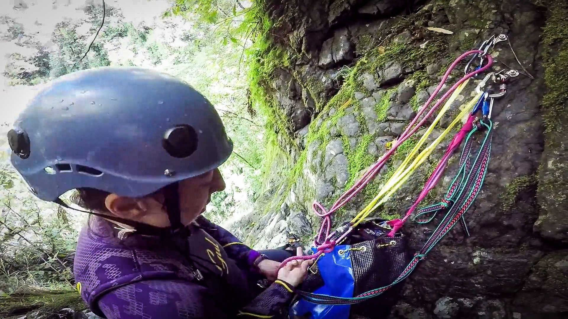 Megan setting up the anchors for another rappel down an Eager Beaver Canyon waterfall
