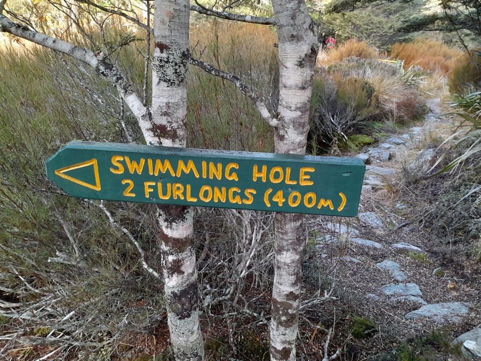 Sign pointing to the swimming hole in Cobb Valley, Kahurangi National Park