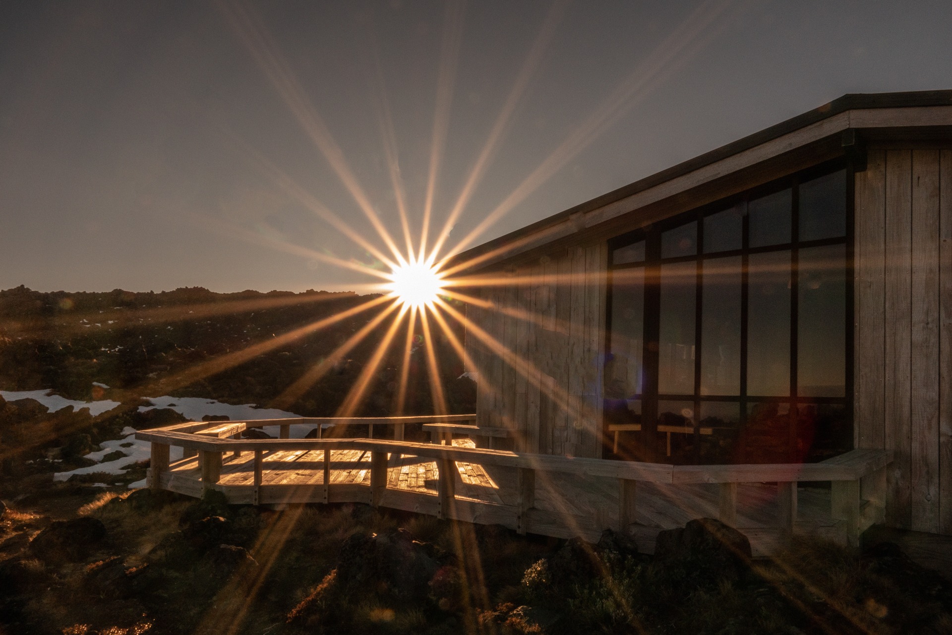 The sun rises over the ridge at WTMC Lodge Mt Ruapehu