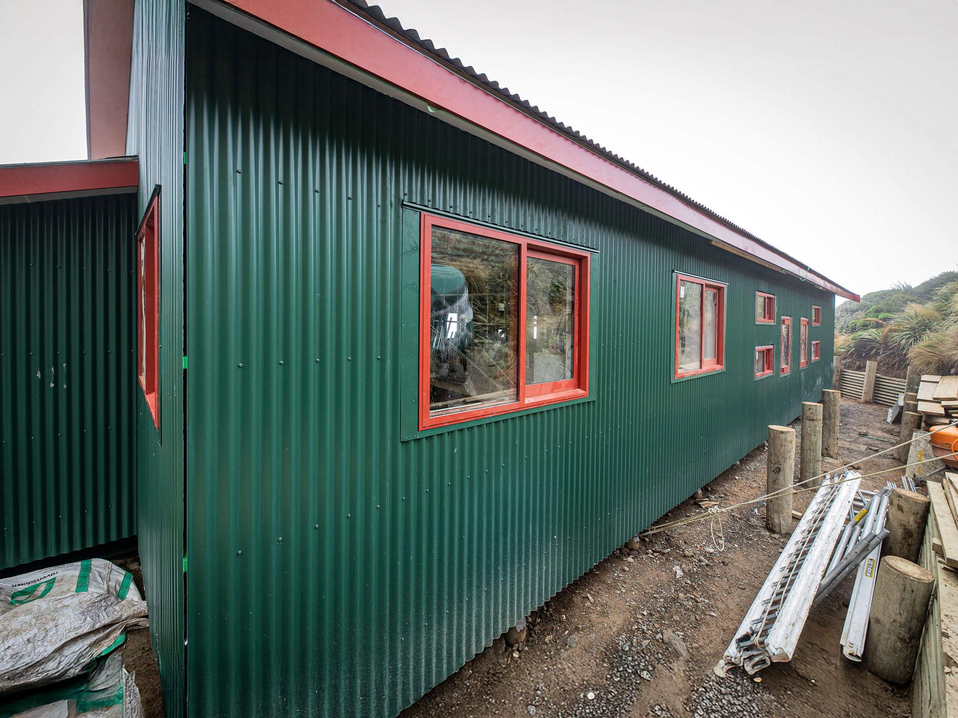 Powell Hut rebuild 2019 showing rear cladding and windows fixed in place